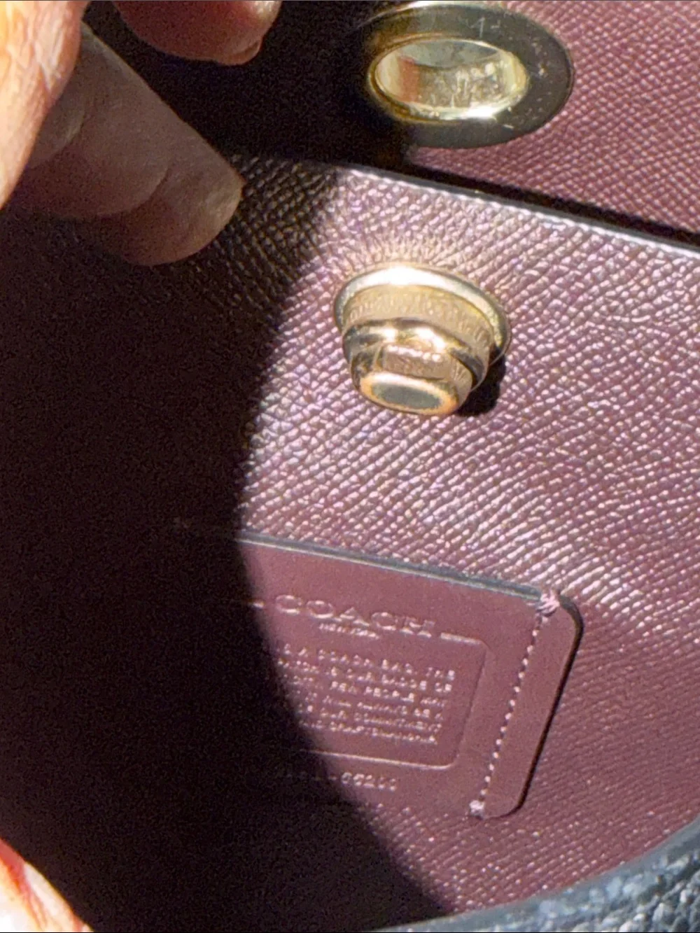 Coach bucket bag, likely the Charlie or Town model